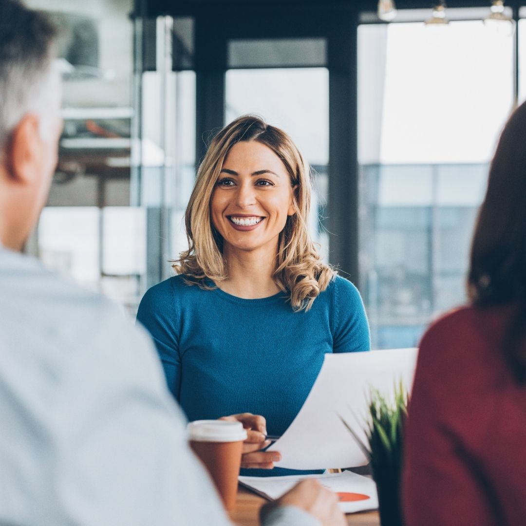 Woman talking to clients