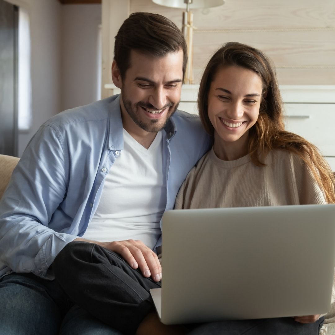 Couple looking at laptop