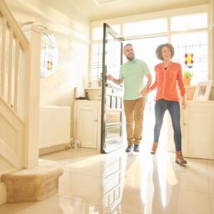 couple walking in to new home