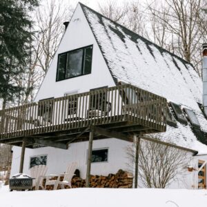 a-frame house with snow on it