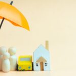 umbrella over family and house